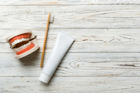 Mouthwash and other oral hygiene products on colored table top view with copy space. flat lay....