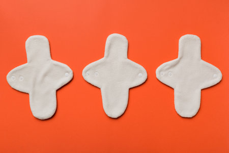 Eco-friendly reusable fabric women's pads. set of colorful bright reusable menstrual pads. zero waste woman periods concept top view with copy space.の写真素材