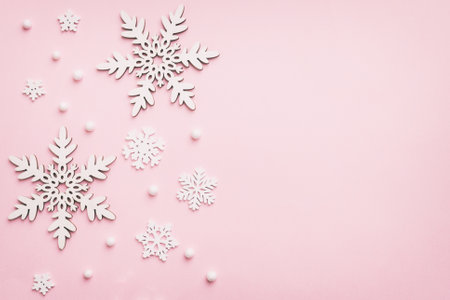 New Year composition white christmas snowflakes. Christmas decor background with pine cones. Top view with copy space.の写真素材