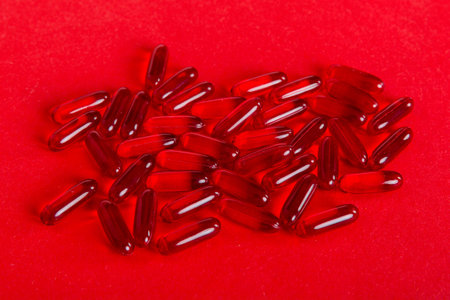 Many colorful pills top viev. Set of many pills on colored background.の写真素材