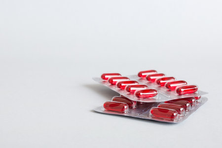 too many different pill cartridges stacked. selective focus. Packs of blister pills with tablets. Colored pastilles packages. A pile of medicine in blister packs. Pharmaceutical blister packs.の写真素材
