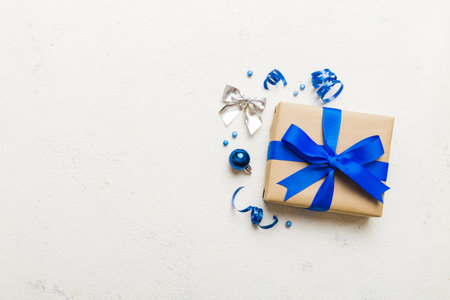 Top view Flat lay Christmas decorations and gift box on colored background with copy space. Christmas or Happy New Year composition.の写真素材