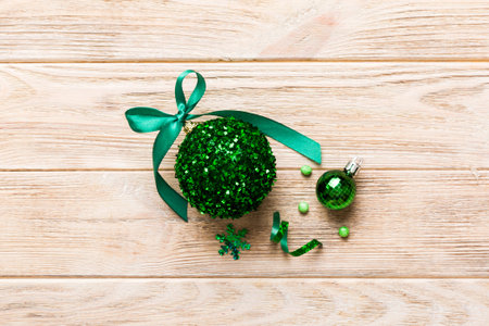 Christmas ball on colored background. decoration bauble with ribbon bow with copy space.の写真素材