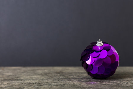 Christmas ball on colored background. decoration bauble with ribbon bow with copy space.の写真素材