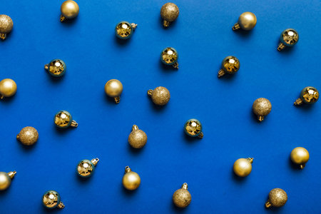 christmas composition. a pattern of christmas balls on colored background. Flat lay, top view New year decor.の写真素材