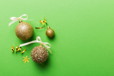 Christmas ball on colored background. decoration bauble with ribbon bow with copy space.の写真素材