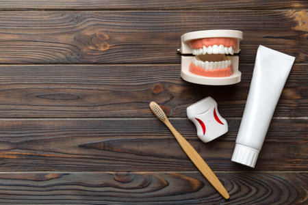 Mouthwash and other oral hygiene products on colored table top view with copy space. flat lay....