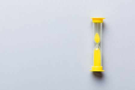 hourglass on the table, sand clock as time passing concept for business deadline, copy space.の写真素材