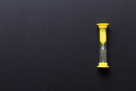 hourglass on the table, sand clock as time passing concept for business deadline, copy space.