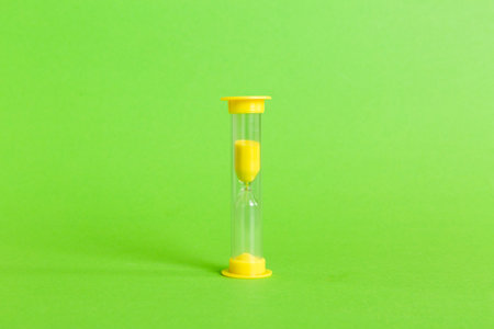 hourglass on the table, sand clock as time passing concept for business deadline, copy space.