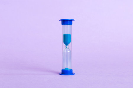 hourglass on the table, sand clock as time passing concept for business deadline, copy space.の写真素材