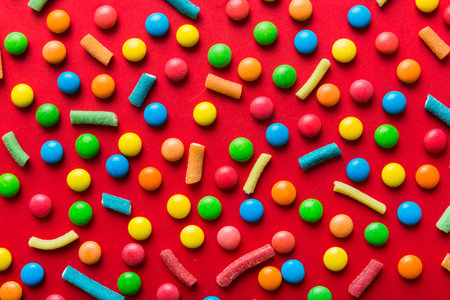 colorful candies as background top view. Seamless pattern with candy. Many sweet candies close-up.