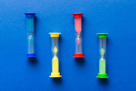 hourglass on the table, sand clock as time passing concept for business deadline, copy space.の写真素材