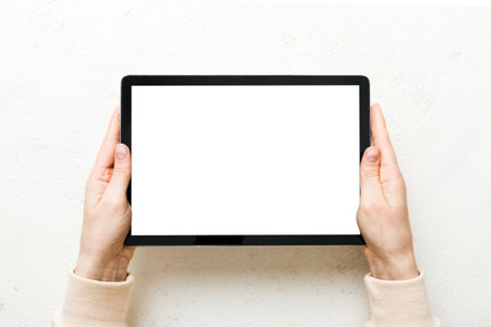 female teen hands using tablet pc with white screen, Mockup image of woman hand holding white tablet...