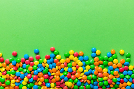 Mixed collection of colorful candy, on colored background. Flat lay, top view. frame of colorful...