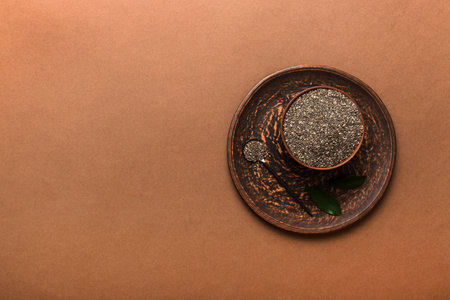 Chia seeds in bowl on colored background. Healthy Salvia hispanica in small bowl. Healthy superfood.の写真素材