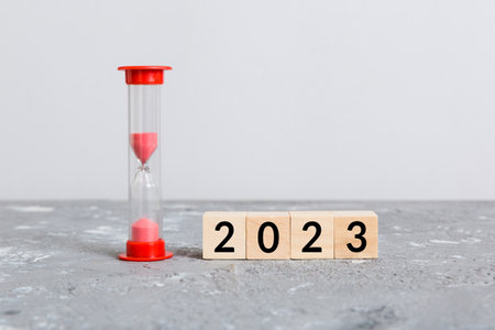 New Year 2023 sand timer. Resolution, time, plan, goal, motivation, reboot, countdown and New Year holiday concepts. Hourglass number 2023.の写真素材