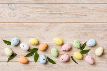 Happy Easter concept. Holiday preparation. Easter eggs on colored background. flat lay top view copy...