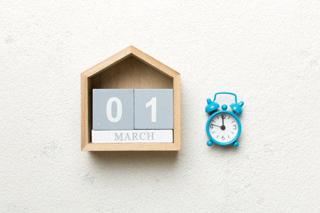 March 1st. Image of March 1 wooden block calendar on colored background. summer day. Empty space for...