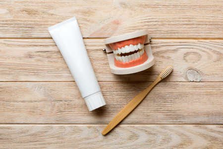 Mouthwash and other oral hygiene products on colored table top view with copy space. flat lay. dental hygiene. oral care kit. Dentist concept.の写真素材