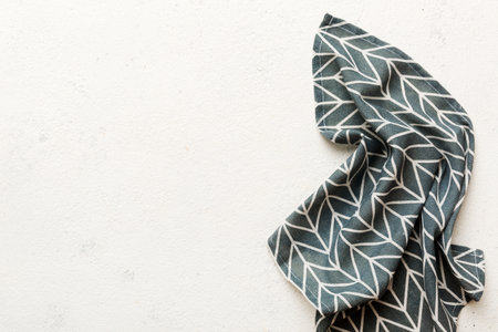 top view with blue kitchen napkin isolated on table background. Folded cloth for mockup with copy space, Flat lay. minimal style.の写真素材