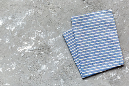 top view with blue kitchen napkin isolated on table background. Folded cloth for mockup with copy space, Flat lay. minimal style.の写真素材
