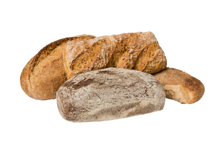 Homemade natural breads. Different kinds of fresh bread isolated on white background, perspective view with copy space.の写真素材
