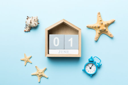 June 1st. Image of june 1 wooden calendar on colored background. summer day. Empty space for text.の写真素材
