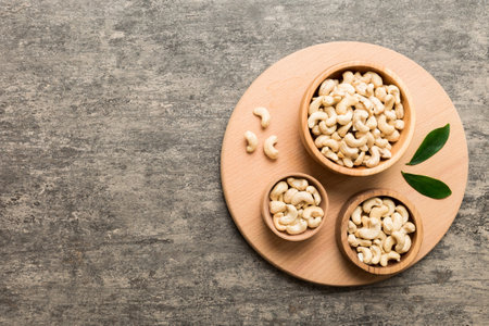 cashew nuts in wooden bowl on table background. top view. Space for text. healthy foodの写真素材