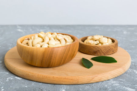 cashew nuts in wooden bowl on table background. top view. Space for text. healthy foodの写真素材
