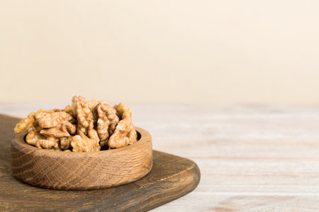 Fresh healthy walnuts in bowl on colored table background. Top view Healthy eating bertholletia concept. super foods.の写真素材