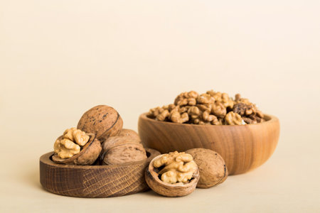 Fresh healthy walnuts in bowl on colored table background. Top view Healthy eating bertholletia...