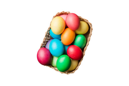 Basket of colorful Easter eggs isolated on white background. Easter basket filled with colored eggs top view holiday concept .の写真素材
