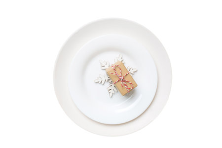 isolated christmas Plate with decor and fork and spoon. new year holiday background. top view.の写真素材