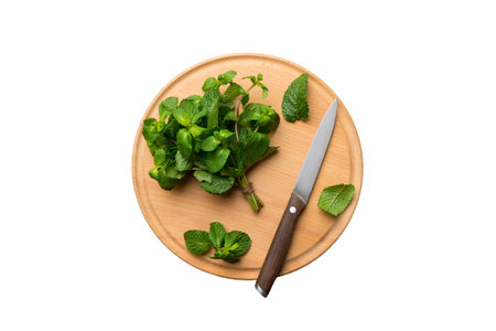 Fresh mint on Cutting board table isolated on white background, top view. Flat lay Space for text.の写真素材