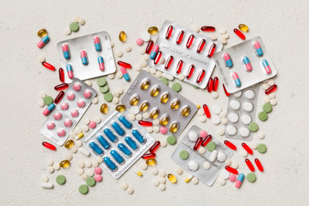 Protective face masks or surgical masks, medicine pills and thermometer on table background. coronavirus disease. Corona virus concept. Space for text.の写真素材