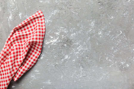top view with red empty kitchen napkin isolated on table background. Folded cloth for mockup with copy space, Flat lay. minimal style.の写真素材