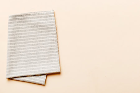 top view with gray kitchen napkin isolated on table background. Folded cloth for mockup with copy space, Flat lay. minimal style.の写真素材