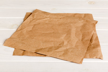 top view with baking parchment empty on table background. Folded cloth for mockup with copy space, Flat lay. minimal style.の写真素材