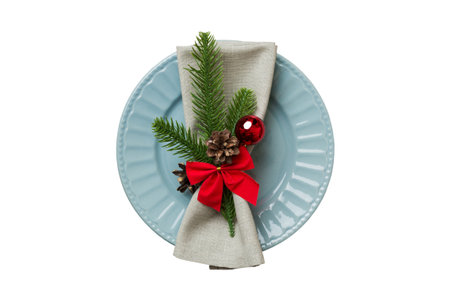 isolated christmas Plate with decor and fork and spoon. new year holiday background. top view.の写真素材
