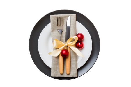 isolated christmas Plate with decor and fork and spoon. new year holiday background. top view.