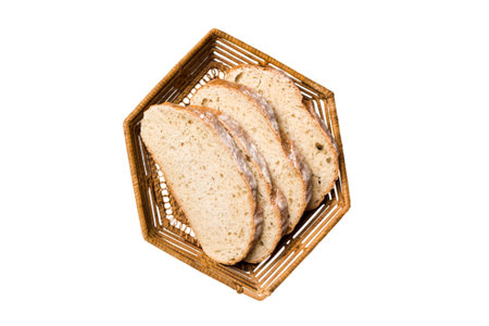Freshly baked bread slices on basket isolated on white background. top view Sliced bread.の写真素材
