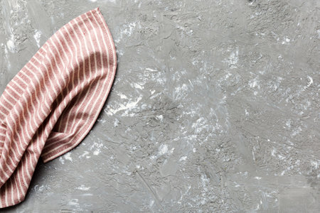 top view with red empty kitchen napkin isolated on table background. Folded cloth for mockup with copy space, Flat lay. minimal style.の写真素材