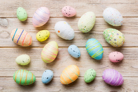 decorative easter eggs on colored background. easter eggs collection top view with copy space.
