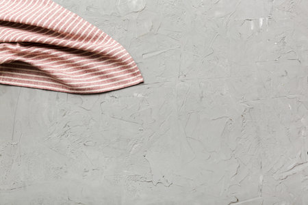 top view with red empty kitchen napkin isolated on table background. Folded cloth for mockup with copy space, Flat lay. minimal style.の写真素材