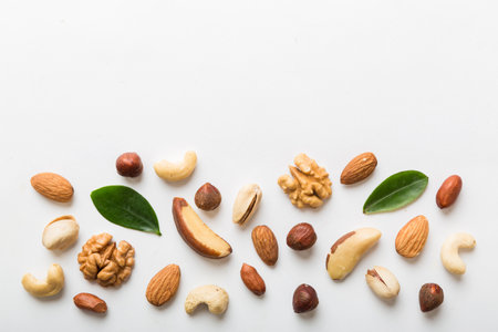 Composition of nuts , flat lay - mix hazelnuts, cashews, almonds on table background. healthy eating...