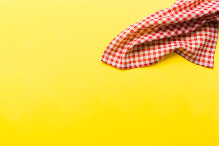 top view with red empty kitchen napkin isolated on table background. Folded cloth for mockup with copy space, Flat lay. minimal style.の写真素材