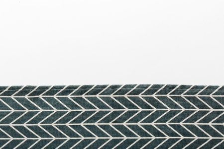 top view with blue kitchen napkin isolated on table background. Folded cloth for mockup with copy...