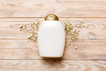 Fancy healthcare bottles for cream with gypsophila branch. Natural oranic spa cosmetics concept. Mockup, template, top view.の写真素材