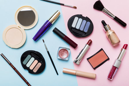 professional makeup tools. top view. flat lay. Beauty, decorative cosmetics. Makeup brushes set and color eyeshadow palette on table background. minimalistic style.の写真素材